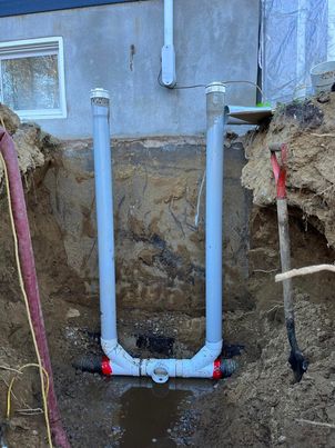 Installation de cheminées d’inspection avec sortie de d’évacuation du drain français